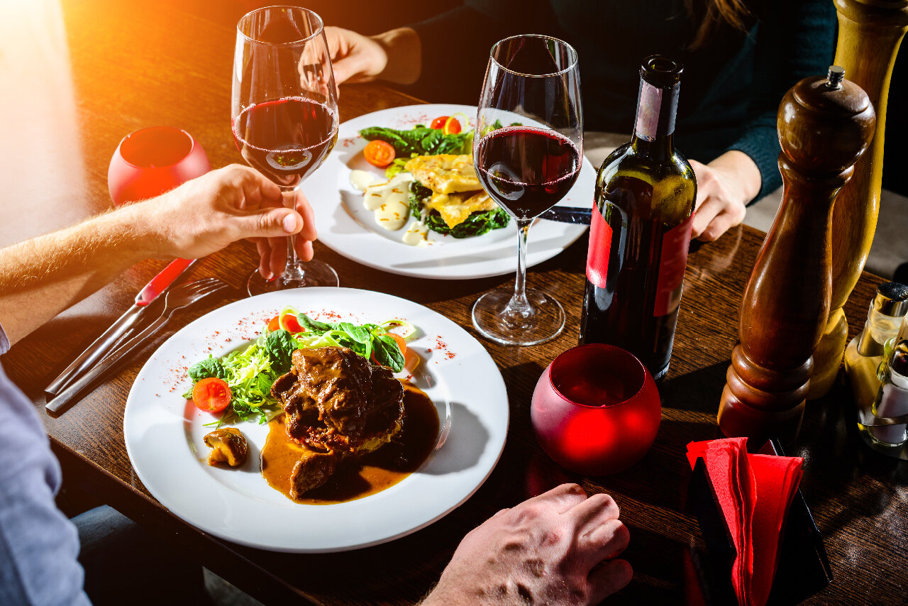 Couple enjoying a cooked meal at a restaurant